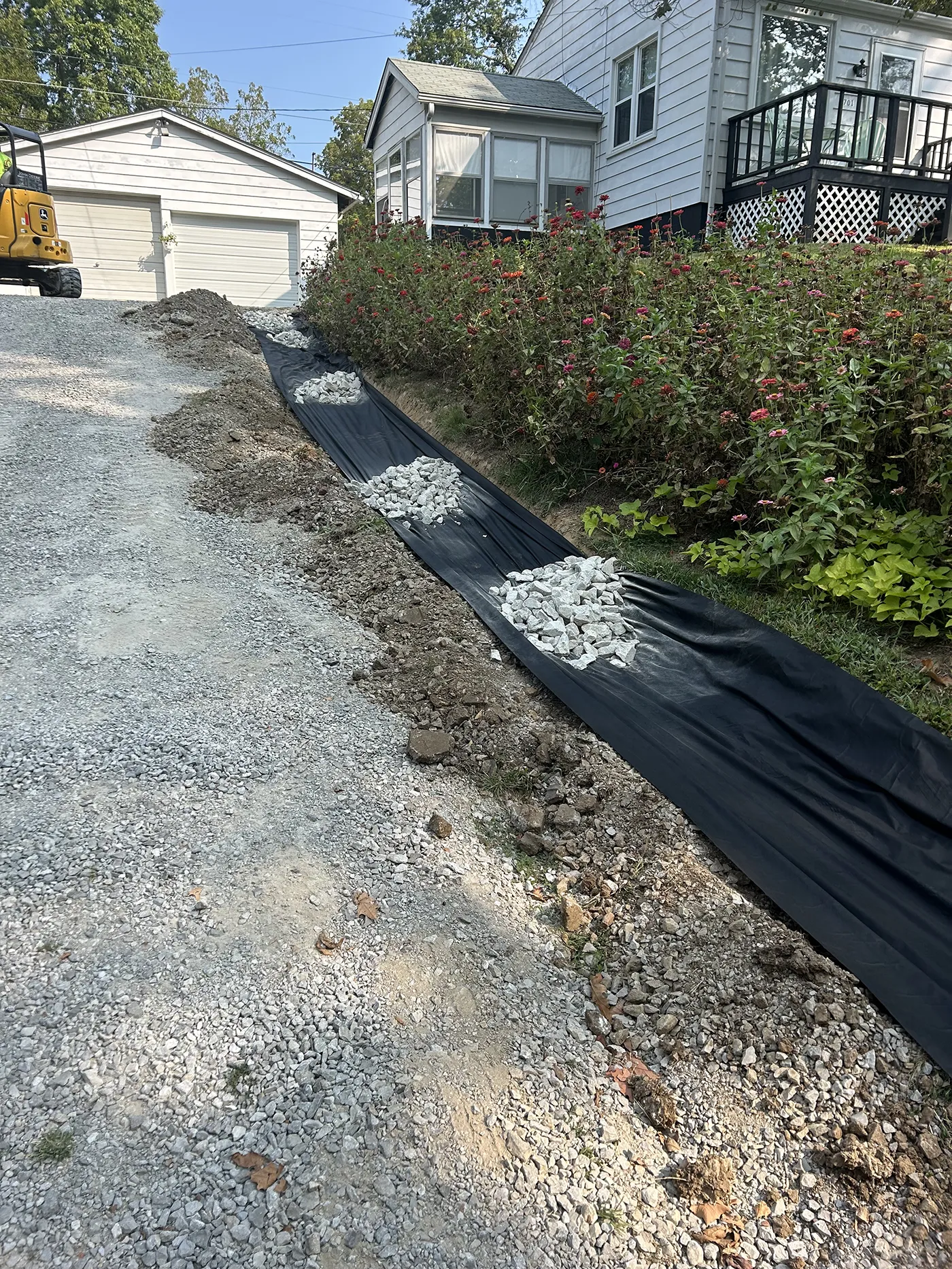 ASA Construction SVC. LLC - Belleville IL - Added 3 Inch Rock With Weed Barrier Along Driveway to Prevent Washout