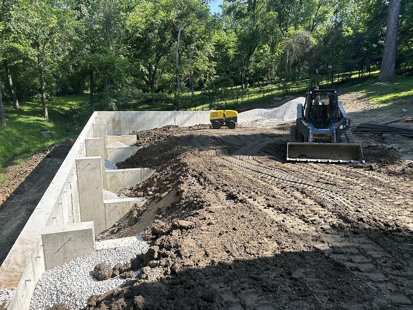 ASA Construction SVC. LLC - Belleville IL - Backfilling in Behind Wall to Raise Ground