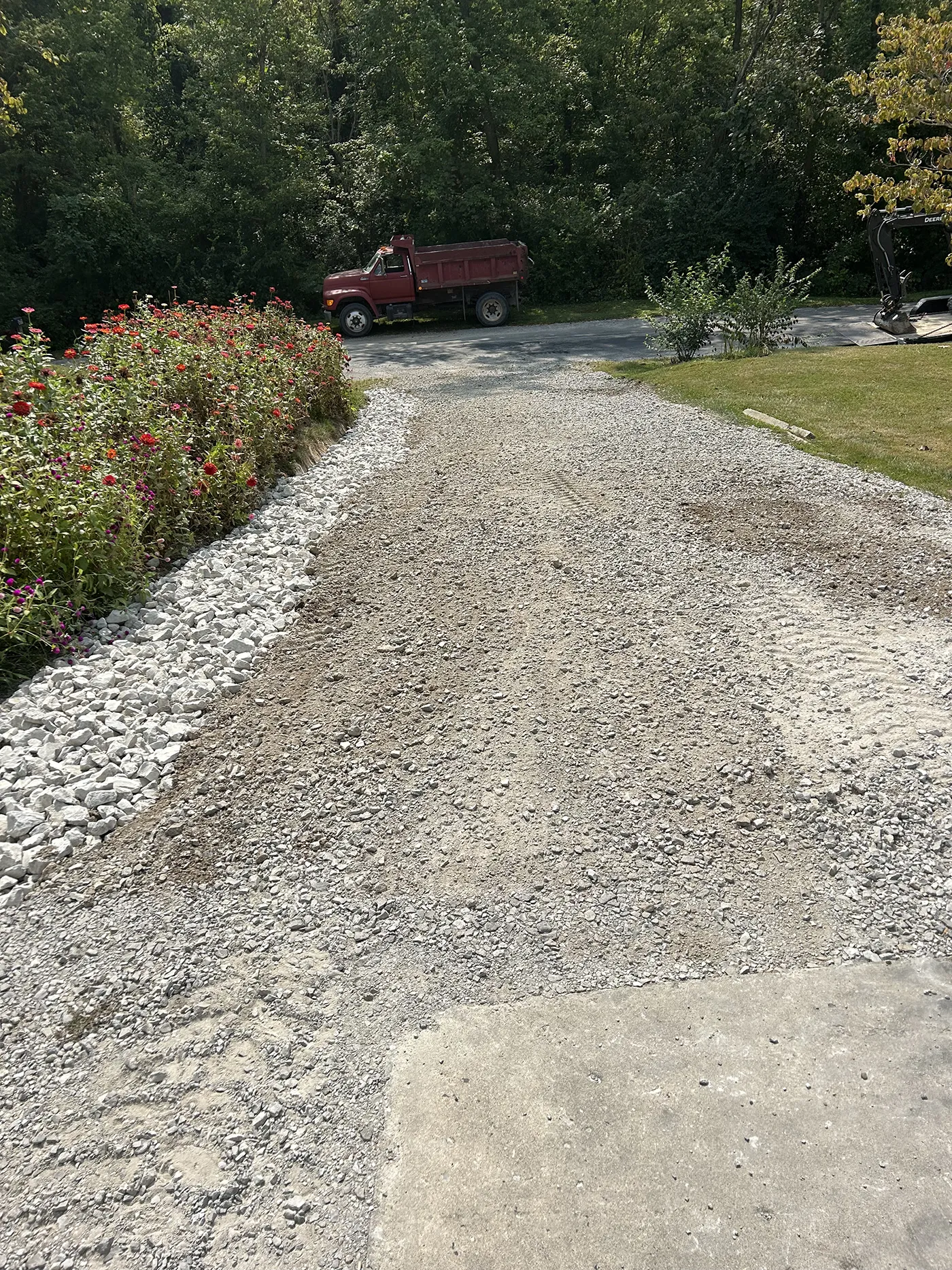 ASA Construction SVC. LLC - Belleville IL - Added 3 Inch Rock With Weed Barrier Along Driveway to Prevent Washout